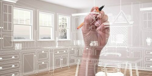 La mano de un arquitecto diseñando sobre una fotografía